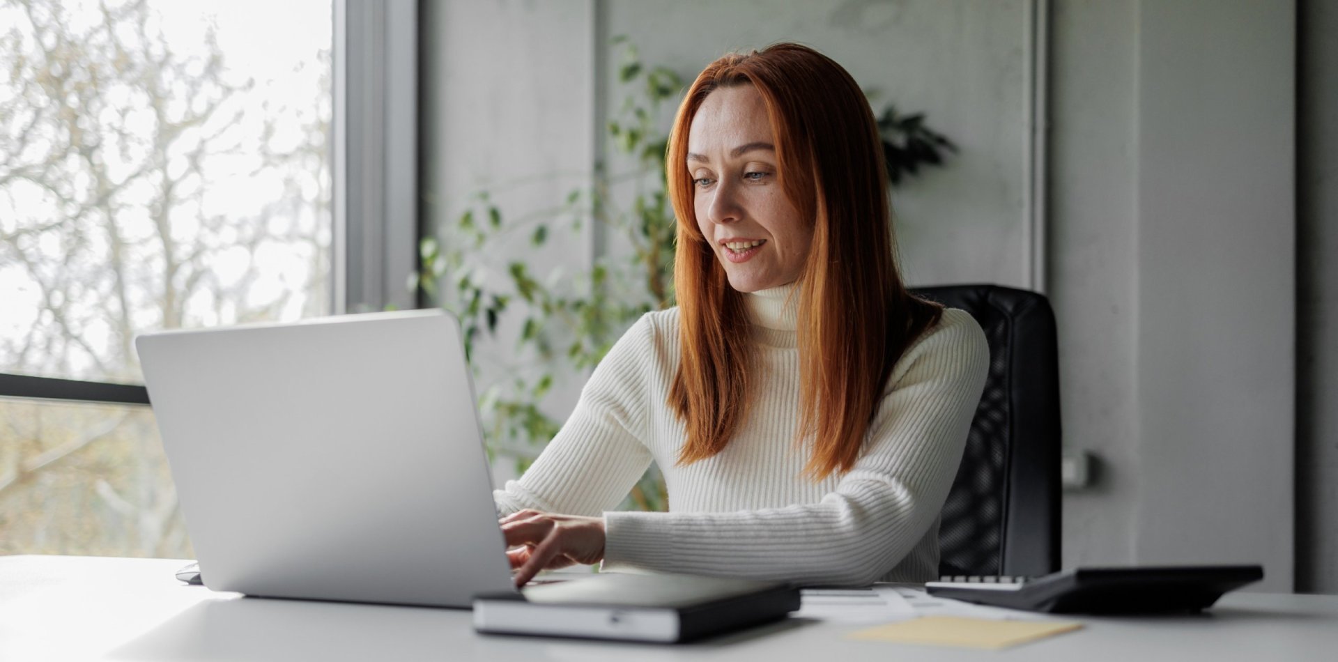 Woman works on laptop