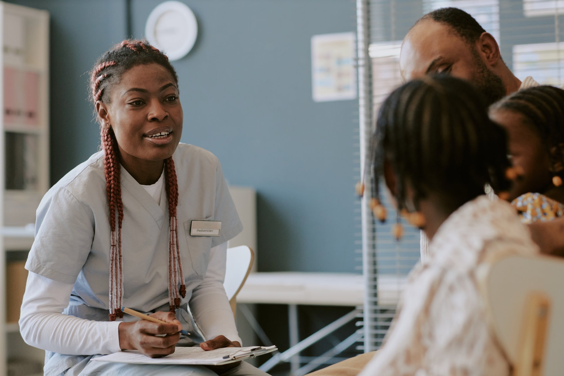 Nurse engaging family members during office visit
