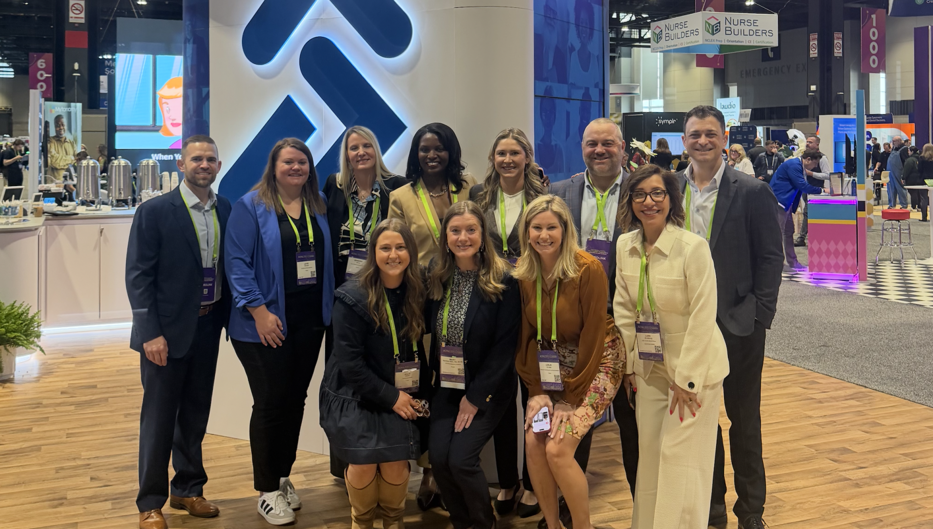 The Prolink AONL 2026 team standing in front of the show floor booth