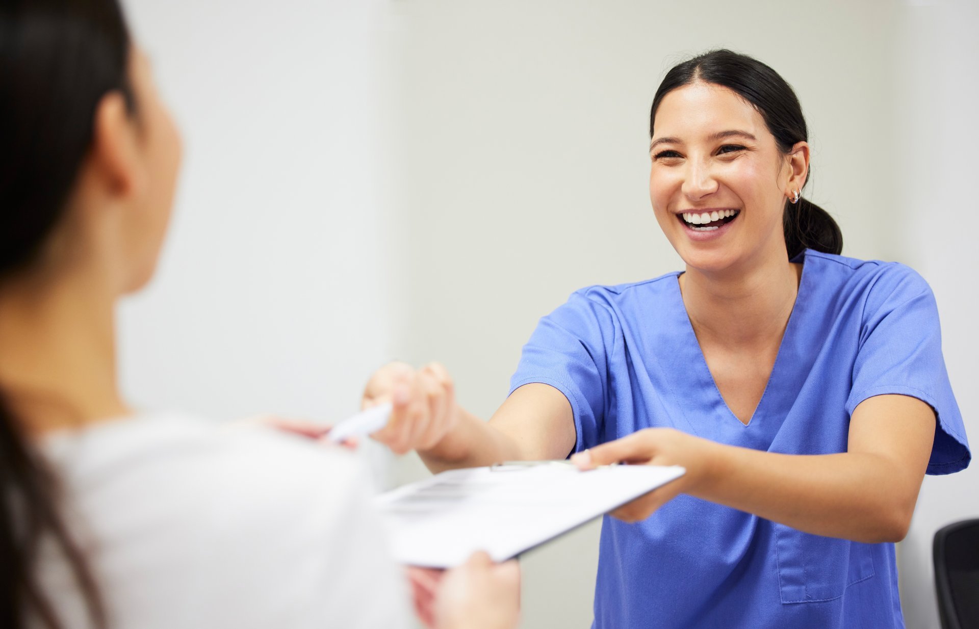 Nurse and patient interacting and smiling