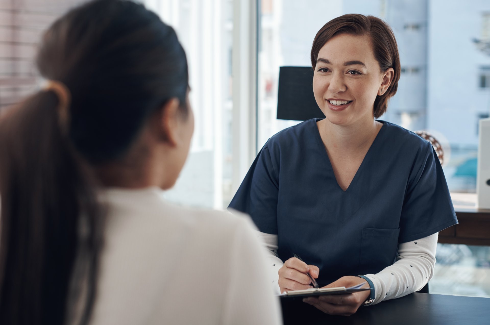 Casual conversation between nurse and healthcare administrator