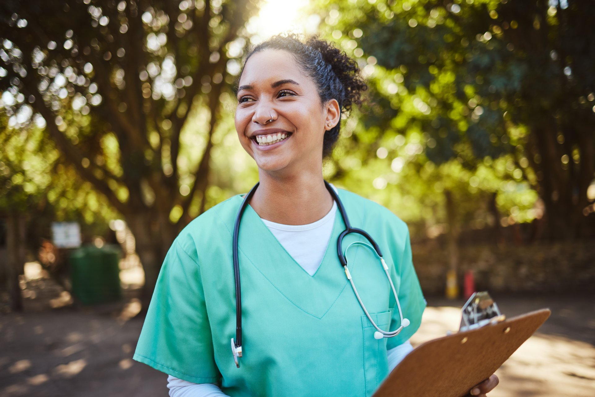 Smiling nurse holding a clipboard