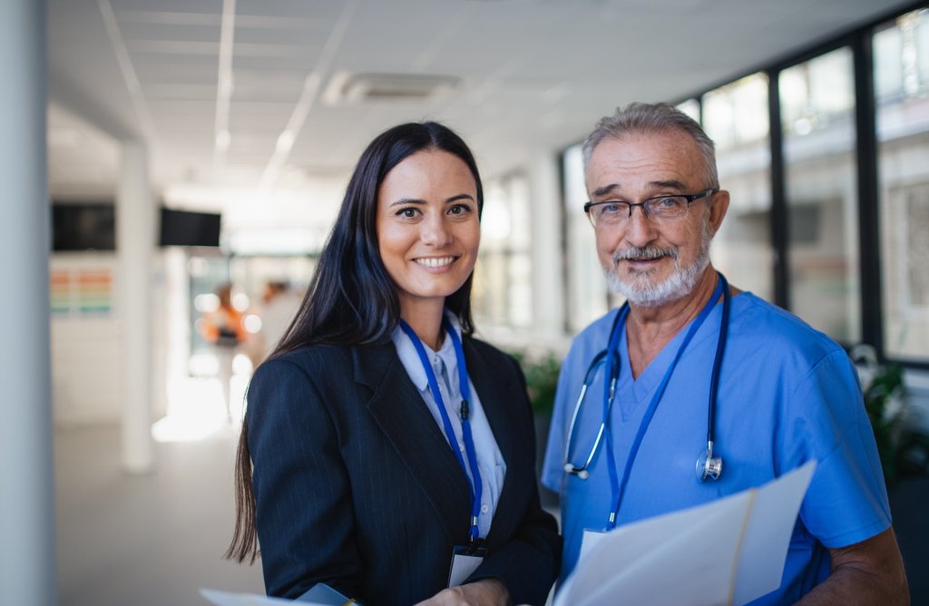 Smiling nurse and hospital administrator