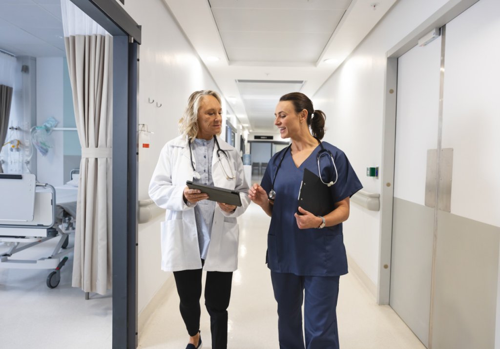 Nurses walking hospital hallway