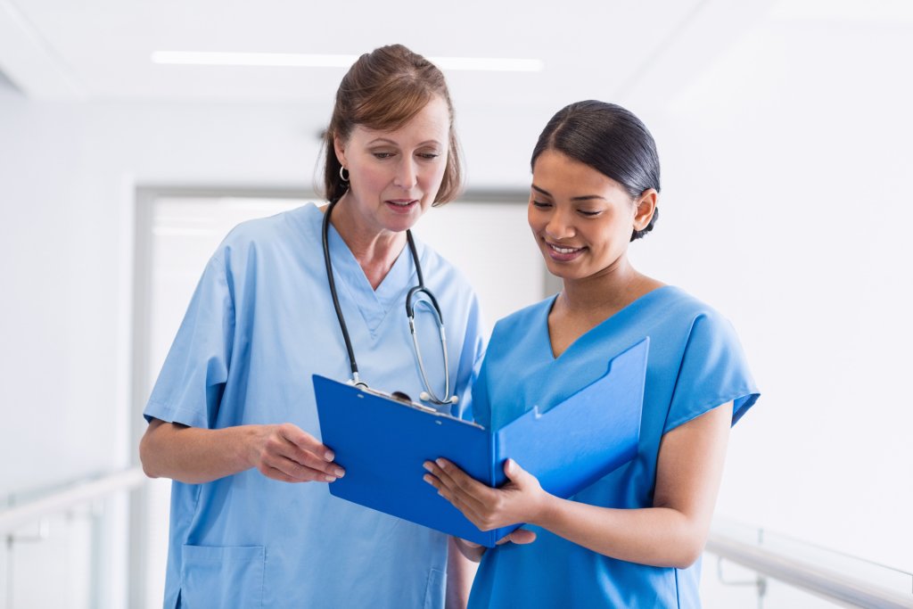 Two nurses discussing a case