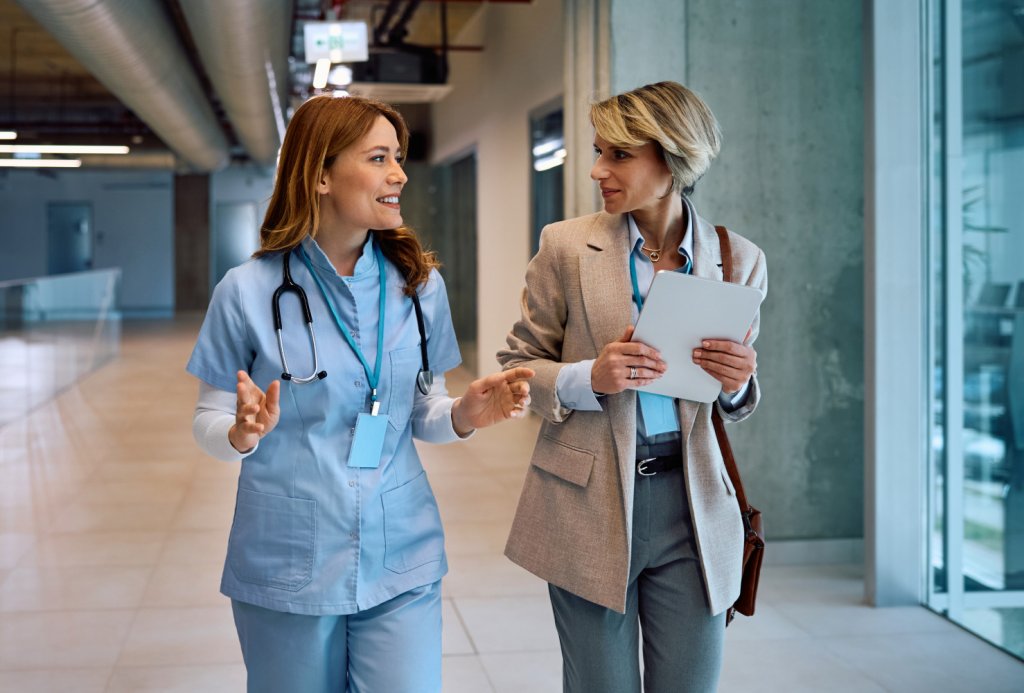 Nurse talking to administrative staff