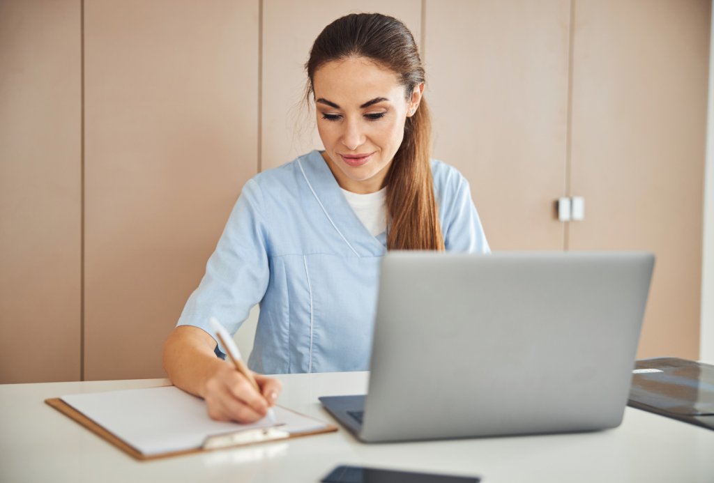Nurse working on laptop
