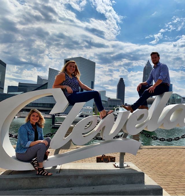 Cleveland Team Hanging on the Cleveland sign